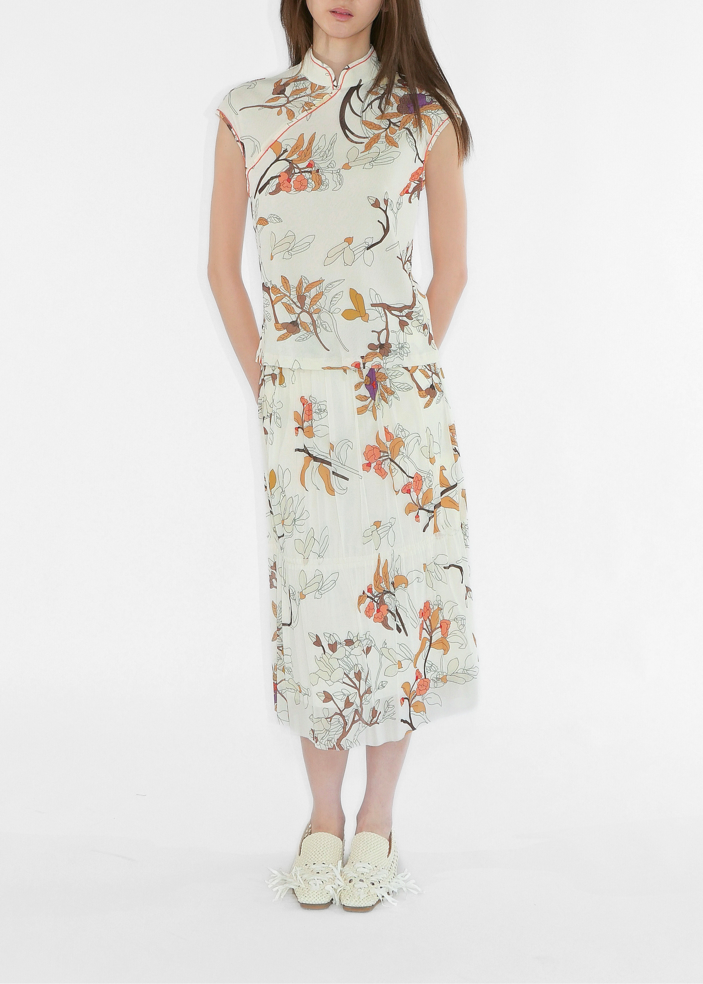 Woman wearing a floral dress on a white background