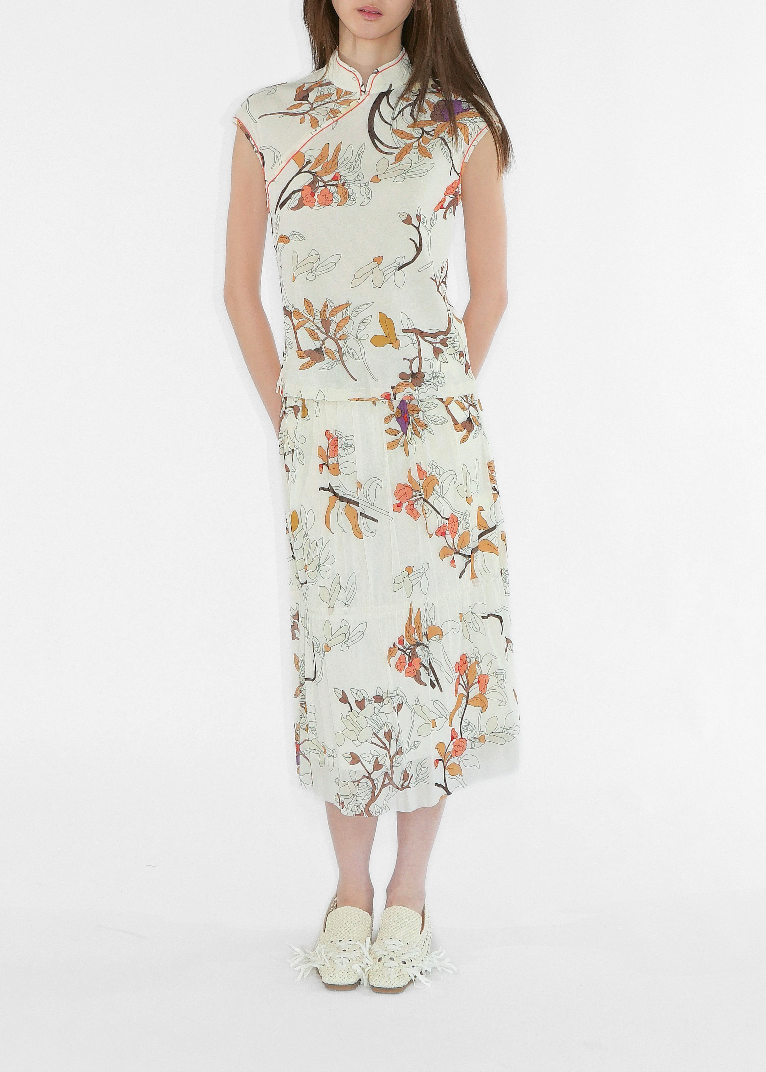 Woman wearing a floral dress on a white background