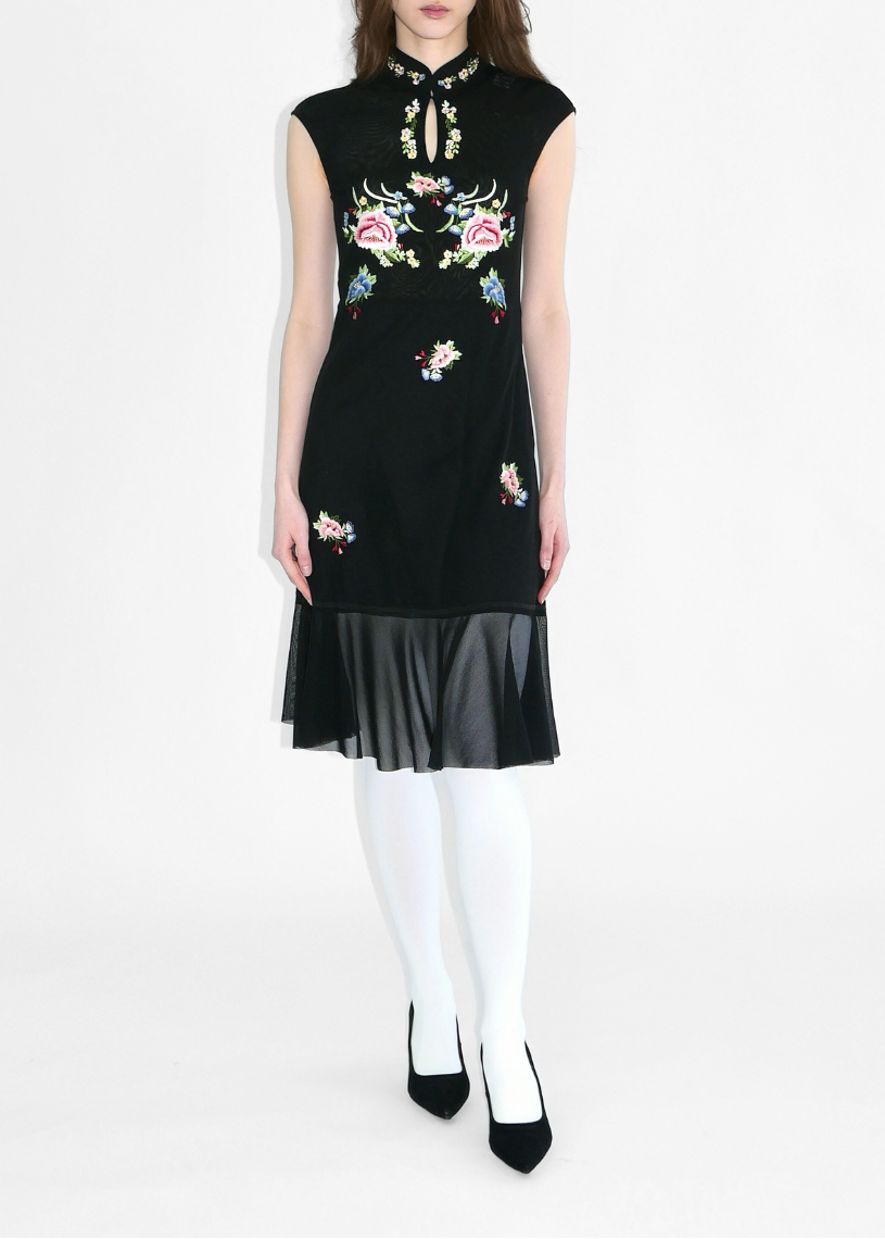 Black sleeveless dress with floral embroidery on a white background