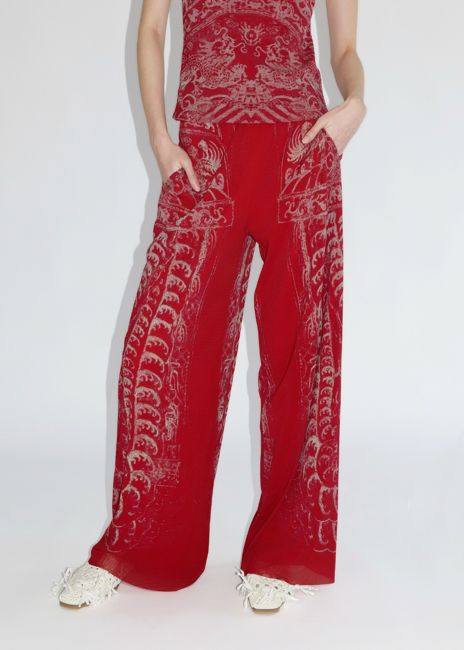 Red outfit with white patterns on a white background
