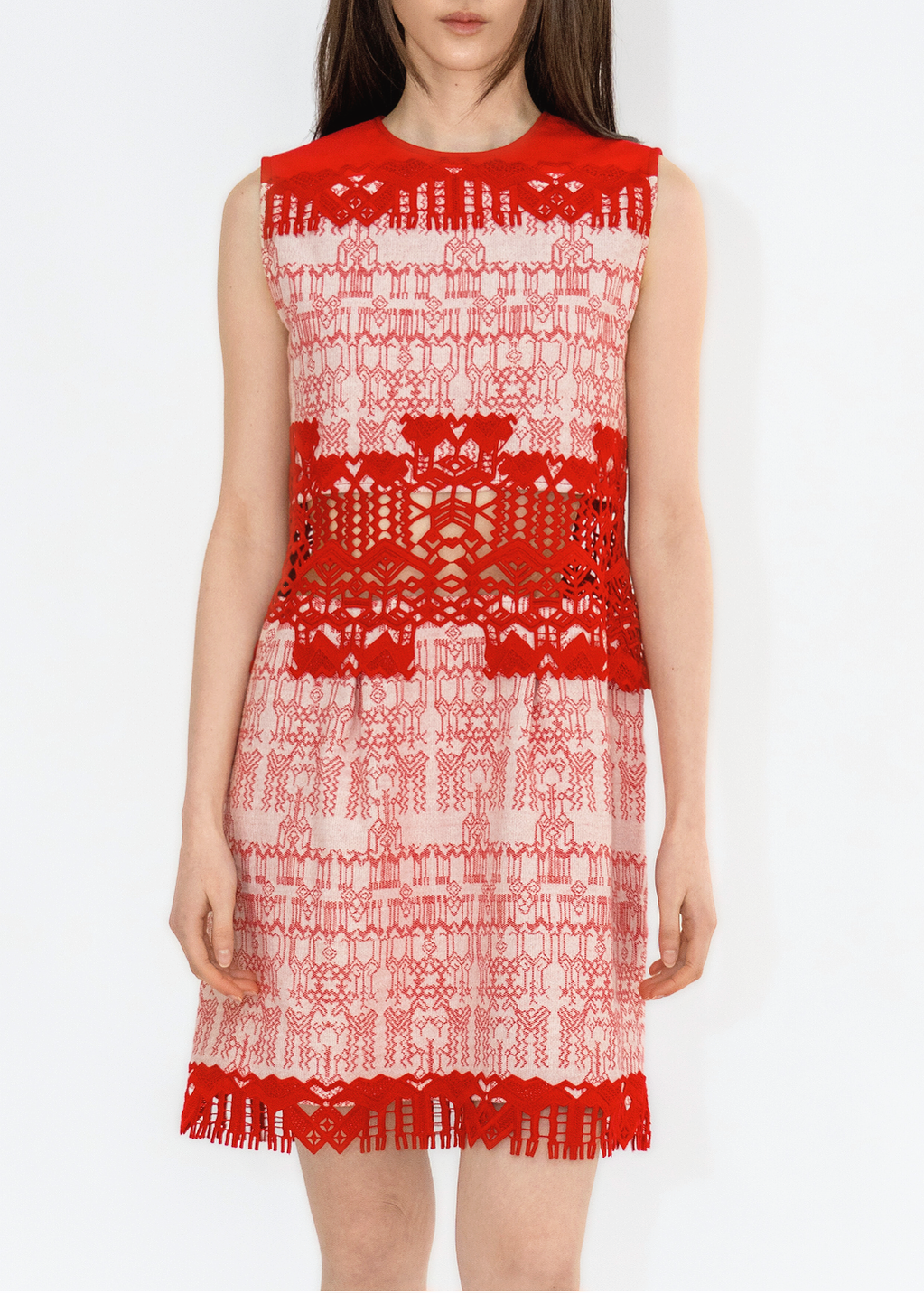 A model wearing a red and white denim dress with lace details from the Spring Summer 2025 Collection.